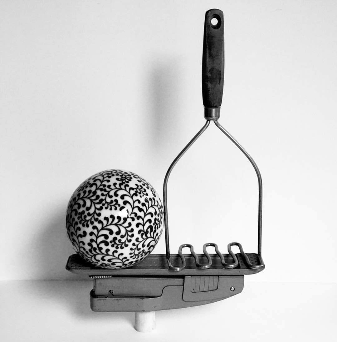 2017 08 14 - 226 of 365 . lamb bone, stapler, ceramic ball, potato masher