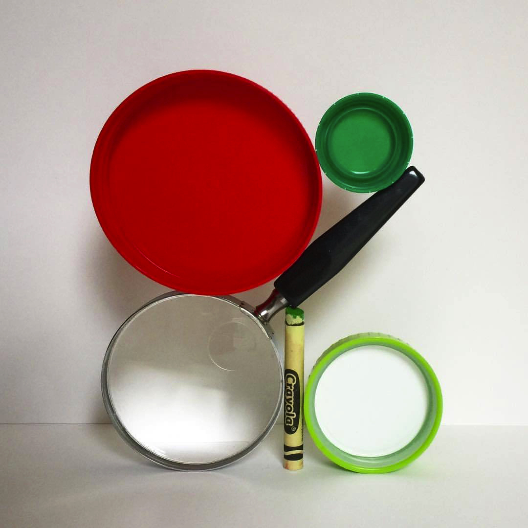 2017 09 08 - 251 of 365 . magnifying glass, crayon, plastic lids