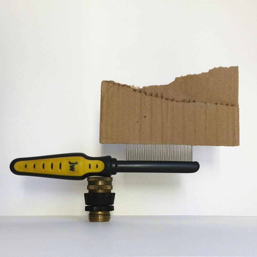 2017 09 10 - 253 of 365 . hose fitting, dog comb, cardboard